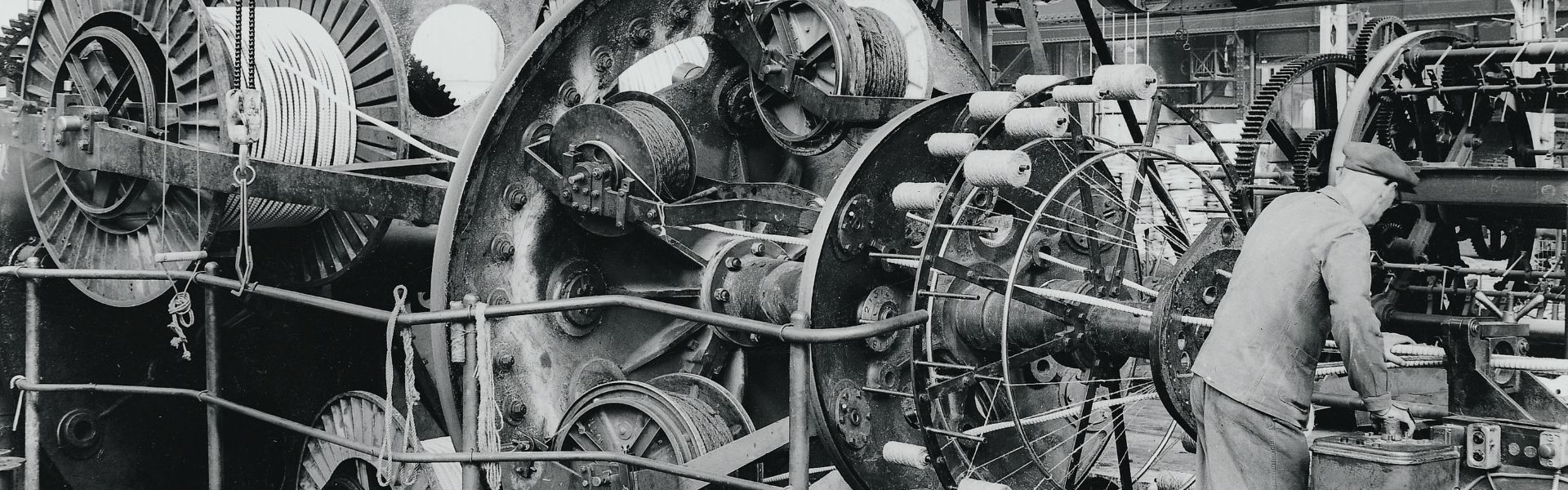 Fifties - an operator working on a stranding machine (cradle-type), Clichy