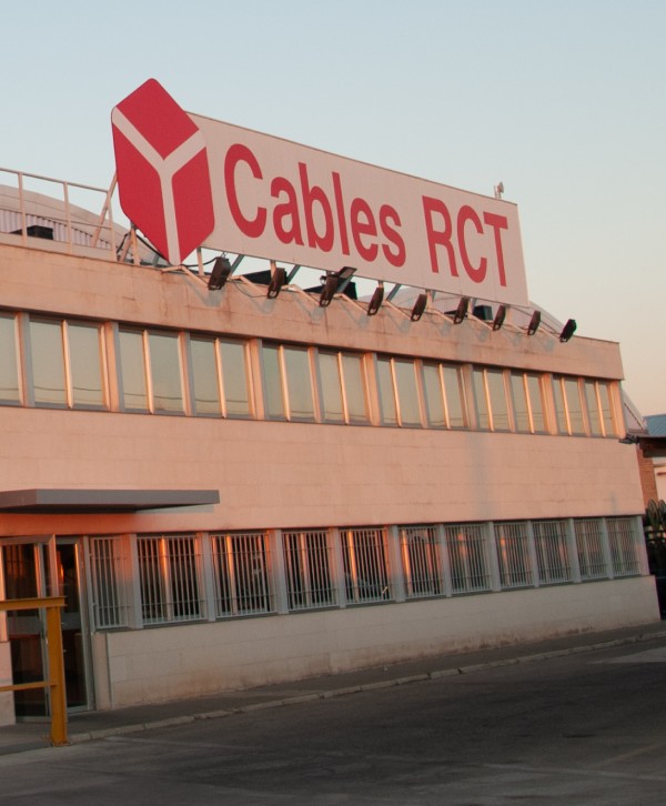 Facade of a building with a prominent sign displaying Cables RCT