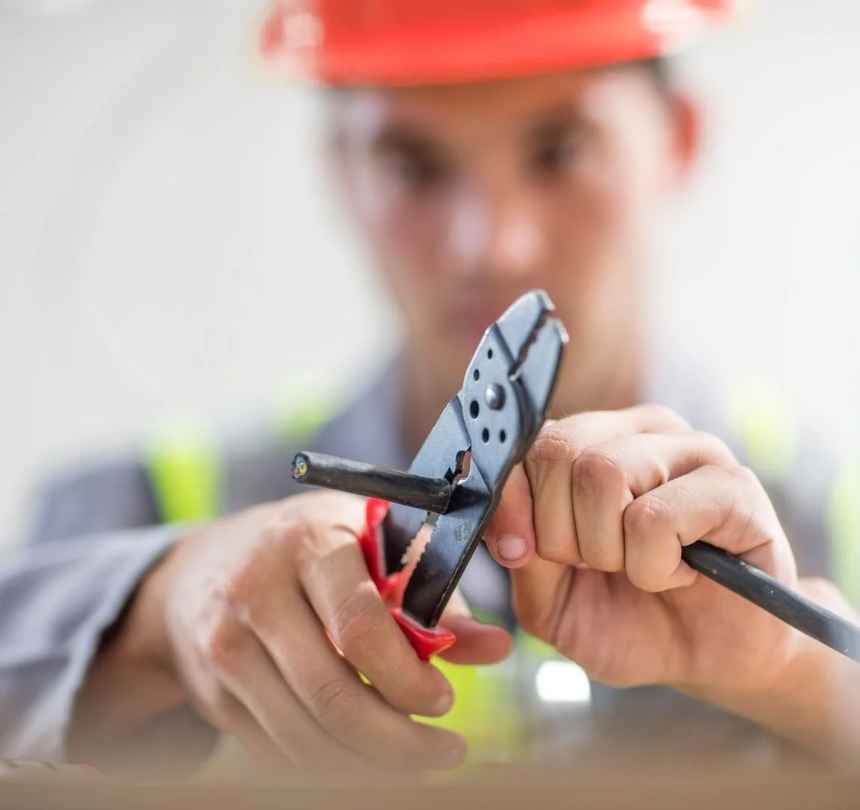 Electrician cutting a cable