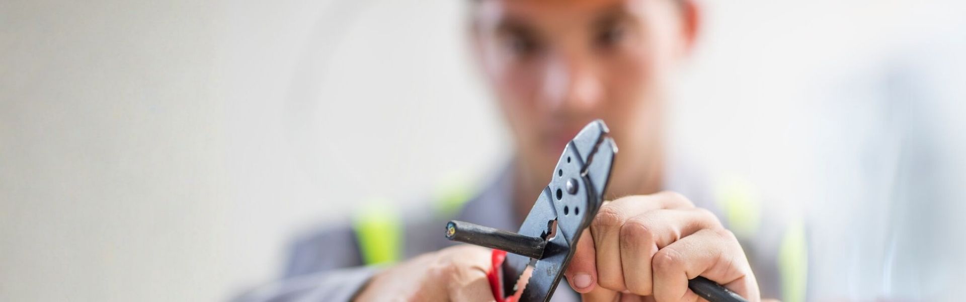 Electrician cutting a cable